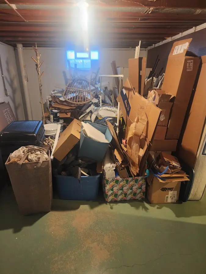 Roll-off dumpster container at job site for 2 Yard Dumpster Rental in Howe